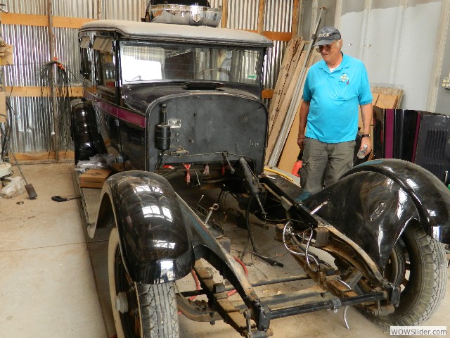 Bill looking over a Stutz four door sedan