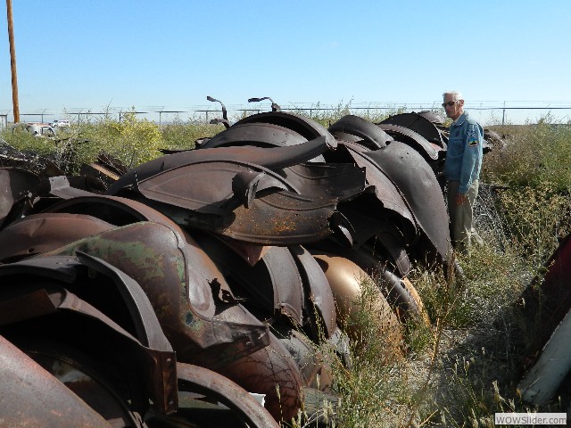 John looking over a pile of fenders